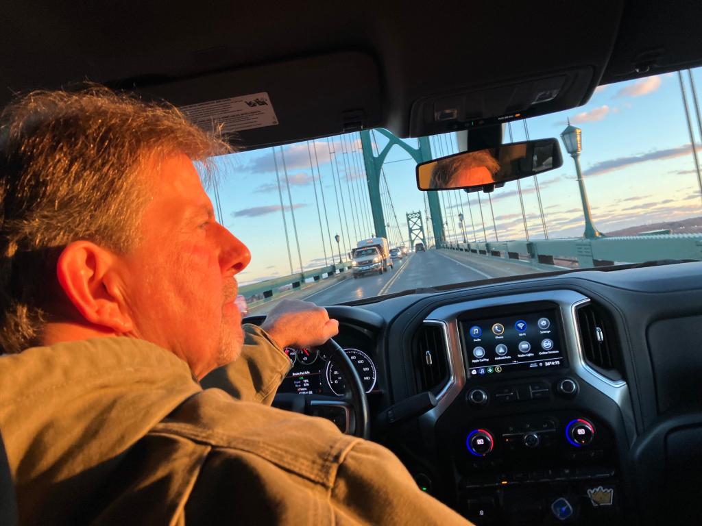 Samaritan Rhode Island volunteer Bryan Ganley drives over the Mount Hope Bridge at sunset on Friday, January 5, 2024. Living in Bristol just miles from the bridge, Ganley has been a volunteer for more than 40 years.