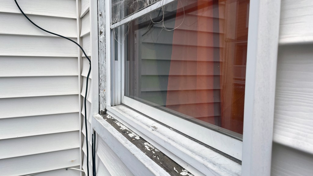 Peeling paint in older houses, like this one in Central Falls, can expose toxic lead-based paint, a particular concern to childrens’ health.